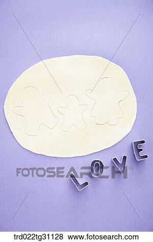 The family shaped cookie dough and the love shaped cookie cutters View Large Photo Image Stock Photo - The family shaped cookie dough and the love shaped cookie cutters. Fotosearch