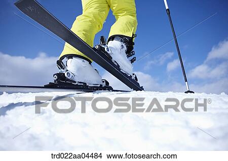 The feet of man wearing the ski board View Large Photo Image Picture - The feet of man wearing the ski board. Fotosearch