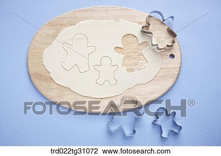 The ginger man cookie cutters on the dough View Large Photo Image Stock Image - The ginger man cookie cutters on the dough. Fotosearch