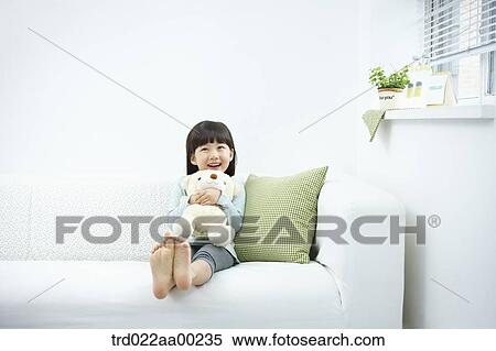 The girl hugging the teddy bear View Large Photo Image Stock Photography - The girl hugging the teddy bear . Fotosearch