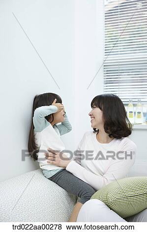 The girl playing with the woman View Large Photo Image Stock Photo - The girl playing with the woman . Fotosearch