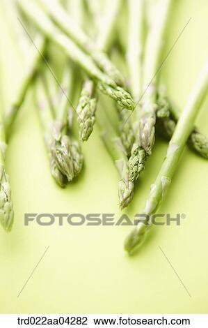 The green asparagus lied on the green table View Large Photo Image Stock Image - The green asparagus lied on the green table. Fotosearch