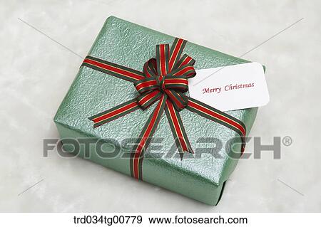 The green gift box with red and green ribbon View Large Photo Image Stock Photo - The green gift box with red and green ribbon . Fotosearch