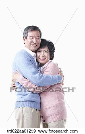The hugging elderly man and woman View Large Photo Image Stock Photo - The hugging elderly man and woman . Fotosearch