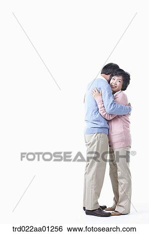 The hugging elderly man and woman View Large Photo Image Stock Photograph - The hugging elderly man and woman . Fotosearch