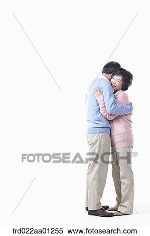 Stock Photography - The hugging elderly man and woman . Fotosearch