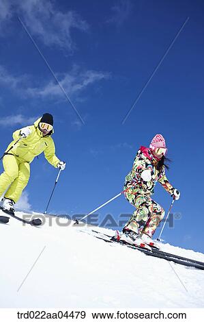 The man and woman skiing on the slope View Large Photo Image Stock Photo - The man and woman skiing on the slope. Fotosearch