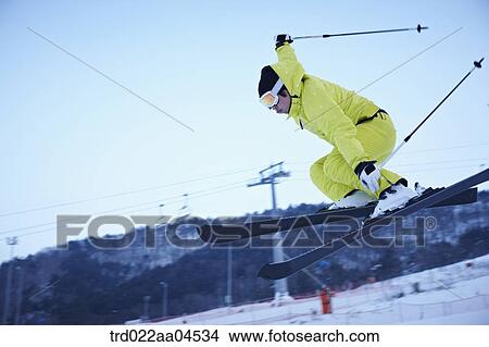 The man jumping on the ski board View Large Photo Image Picture - The man jumping on the ski board. Fotosearch