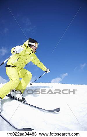 Stock Image - The man skiing on the slope. Fotosearch