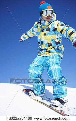 The man snowboarding on the slope View Large Photo Image Stock Photograph - The man snowboarding on the slope. Fotosearch