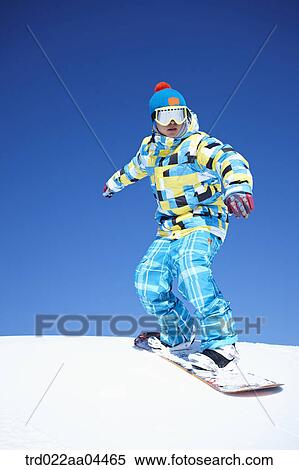 The man snowboarding on the slope View Large Photo Image Stock Photography - The man snowboarding on the slope. Fotosearch