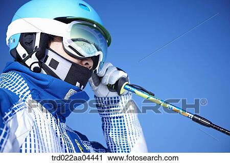 The man wearing skiwear with the ski pole View Large Photo Image Stock Image - The man wearing skiwear with the ski pole . Fotosearch