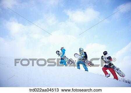 The people climbing the slope with the snowboards View Large Photo Image Stock Image - The people climbing the slope with the snowboards. Fotosearch