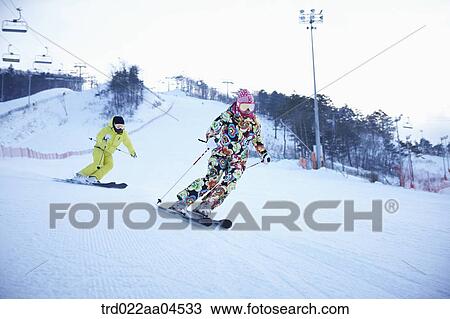 Stock Image - The people skiing on the slope. Fotosearch
