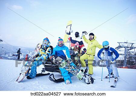 The people wearing the ski and snowboarding gear in the ski resort View Large Photo Image Stock Photo - The people wearing the ski and snowboarding gear in the ski resort. Fotosearch