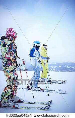 Picture - The people wearing the ski gear on the slope. Fotosearch