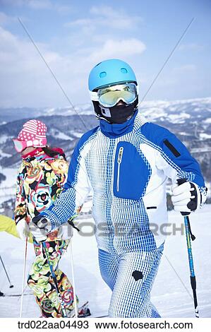 The people wearing the ski gear on the snow View Large Photo Image Stock Image - The people wearing the ski gear on the snow. Fotosearch