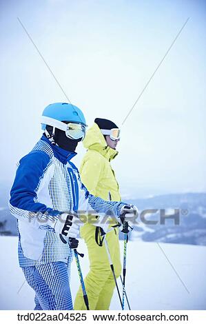 The people wearing the ski gear on the slope View Large Photo Image Stock Photography - The people wearing the ski gear on the slope. Fotosearch