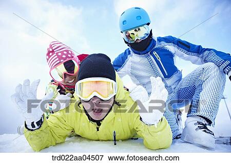 The people wearing the ski wear on the slope View Large Photo Image Stock Photo - The people wearing the ski wear on the slope. Fotosearch