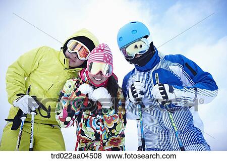 Stock Photo - The people wearing the ski wear with the ski gear. Fotosearch
