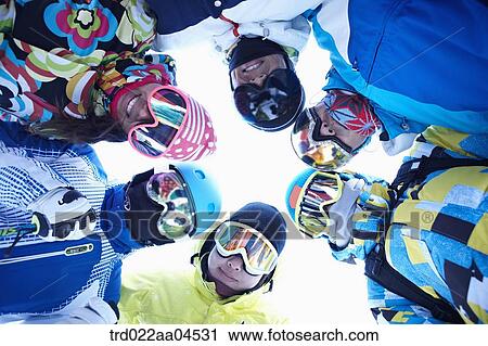 The people wearing the skiwear putting their heads together View Large Photo Image Stock Image - The people wearing the skiwear putting their heads together. Fotosearch
