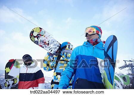 The people wearing the snowboarding wear with the snowboard View Large Photo Image Stock Photo - The people wearing the snowboarding wear with the snowboard. Fotosearch
