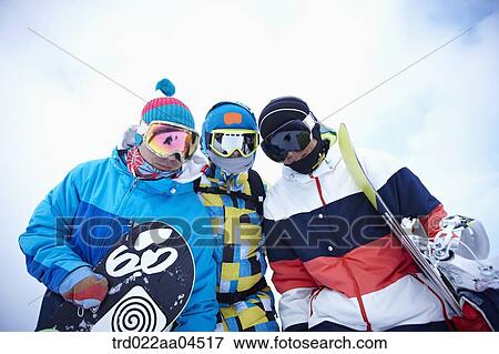 The people wearing the snowboarding wear with the snowboards View Large Photo Image Stock Photo - The people wearing the snowboarding wear with the snowboards. Fotosearch