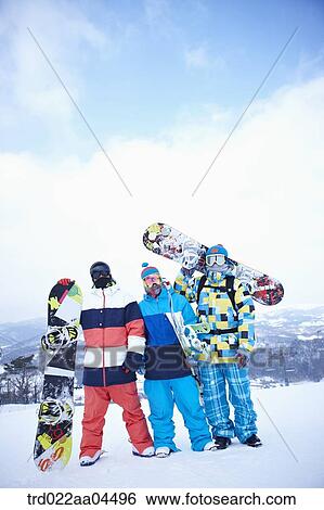 The people wearing the snowboarding wear with the snowboard View Large Photo Image Stock Photograph - The people wearing the snowboarding wear with the snowboard. Fotosearch