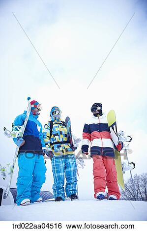 The people wearing the snowboarding wear with the snowboards View Large Photo Image Stock Photograph - The people wearing the snowboarding wear with the snowboards. Fotosearch