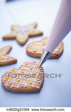 The pink icing bag on the cookie View Large Photo Image Picture - The pink icing bag on the cookie . Fotosearch