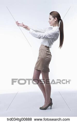 The presenting woman with her hands View Large Photo Image Stock Photo - The presenting woman with her hands. Fotosearch