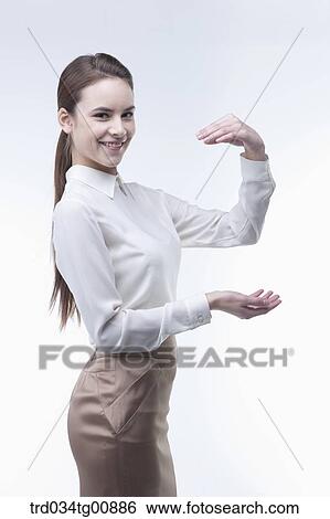 The presenting woman with her hands View Large Photo Image Stock Photograph - The presenting woman with her hands. Fotosearch