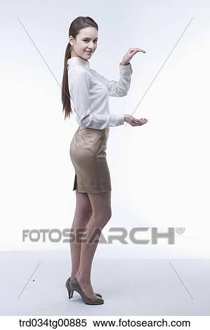 The presenting woman with her hands View Large Photo Image Stock Photography - The presenting woman with her hands. Fotosearch