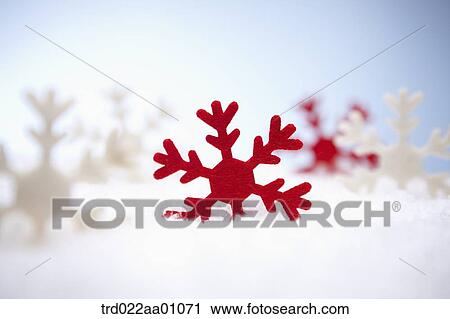 The red and white snowflake on the snow View Large Photo Image Stock Image - The red and white snowflake on the snow. Fotosearch