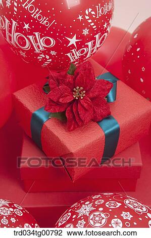 The red gift box with blue ribbon and red flower decoration View Large Photo Image Stock Image - The red gift box with blue ribbon and red flower decoration . Fotosearch