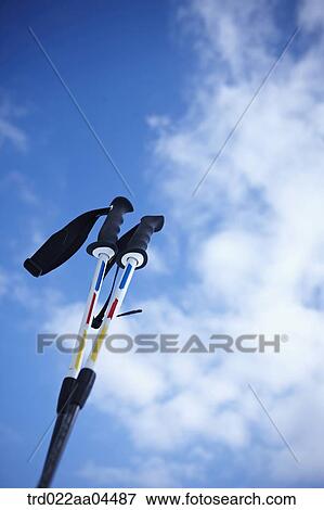 The ski poles and the blue sky View Large Photo Image Stock Photo - The ski poles and the blue sky. Fotosearch