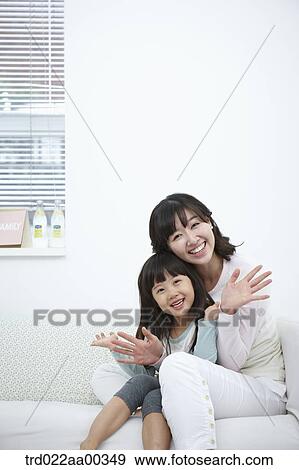 The smiling woman and girl with their palms open View Large Photo Image Stock Photo - The smiling woman and girl with their palms open. Fotosearch