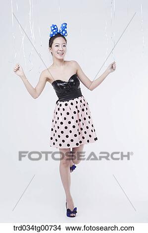 The smiling woman holding the string of balloon View Large Photo Image Picture - The smiling woman holding the string of balloon. Fotosearch