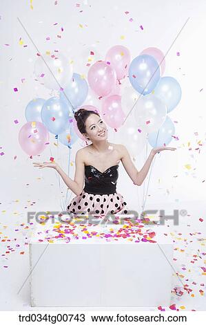 The smiling woman with party flower flake around View Large Photo Image Stock Image - The smiling woman with party flower flake around. Fotosearch