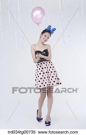The smiling woman with pink balloon View Large Photo Image Stock Photography - The smiling woman with pink balloon. Fotosearch
