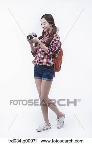 The smiling woman with the camera View Large Photo Image Stock Image - The smiling woman with the camera. Fotosearch