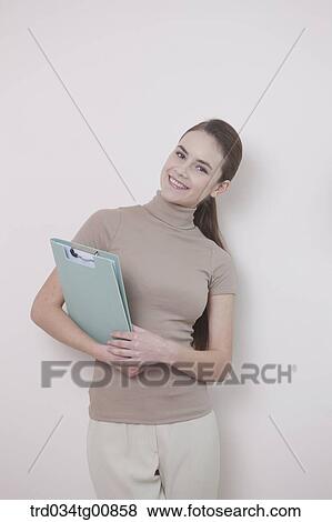 Stock Photo - The smiling woman with the document. Fotosearch