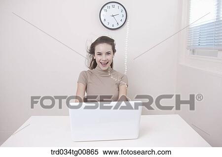The smiling woman with the laptop View Large Photo Image Stock Photography - The smiling woman with the laptop . Fotosearch