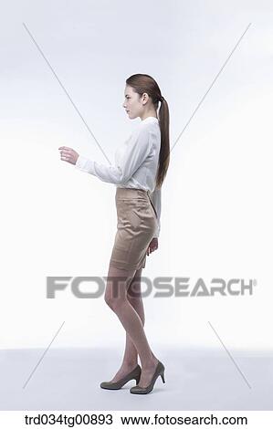 The standing woman from the side View Large Photo Image Stock Image - The standing woman from the side. Fotosearch