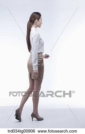 The standing woman from the side View Large Photo Image Stock Photograph - The standing woman from the side. Fotosearch