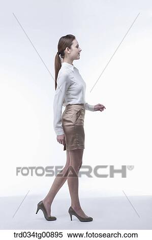 Stock Photography - The standing woman from the side. Fotosearch