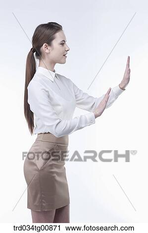 The standing woman with her touching palms from the side View Large Photo Image Stock Image - The standing woman with her touching palms from the side. Fotosearch