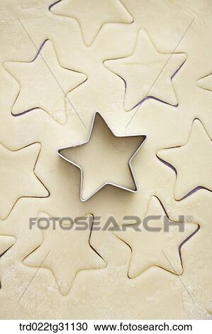 The star shaped cookie cutter on the dough View Large Photo Image Stock Image - The star shaped cookie cutter on the dough . Fotosearch