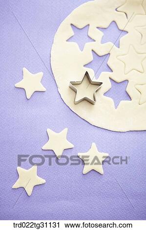 The star shaped cookie cutter on the dough View Large Photo Image Stock Image - The star shaped cookie cutter on the dough . Fotosearch