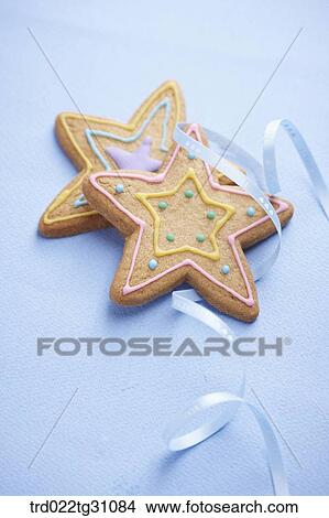 Picture - The star shaped cookie with the blue string. Fotosearch